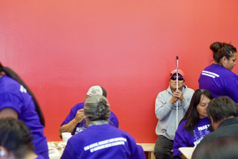 Blind man Darren Nez waits for assistance as lunch is served at the Navajo Nation Museum following a disabilities awareness march from the Navajo Shopping Center to the President's office in Window Rock Wednesday. © 2011 Gallup Independent / Cable Hoover 